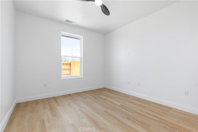 13165 N Bluffs Ct, San Miguel, CA 93451 - unfurnished room with a ceiling fan, light wood-style floors, and baseboards