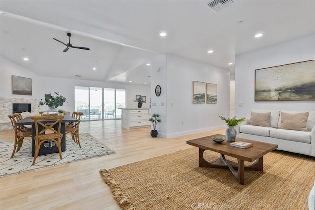 13165 N Bluffs Ct, San Miguel, CA 93451 - living room featuring light wood-type flooring, a ceiling fan, baseboards, recessed lighting, and a fireplace