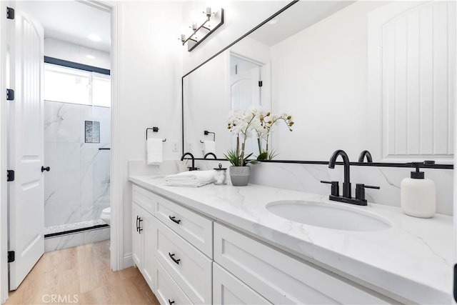 13165 N Bluffs Ct, San Miguel, CA 93451 - full bath featuring double vanity, wood finished floors, a marble finish shower, and toilet