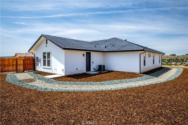 13165 N Bluffs Ct, San Miguel, CA 93451 - back of property with central air condition unit, stucco siding, and a tiled roof