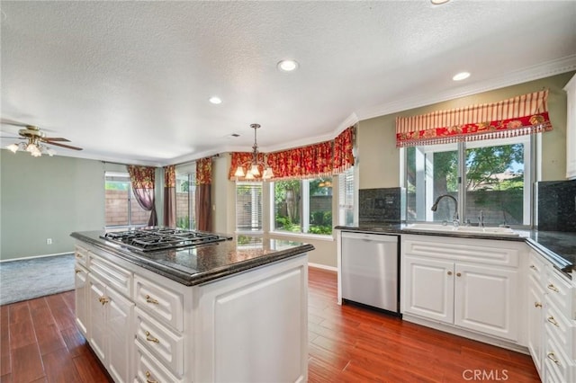 12958 Boston Ave, Chino, CA 91710 - kitchen featuring appliances with stainless steel finishes, a sink, dark wood-type flooring, plenty of natural light, and recessed lighting
