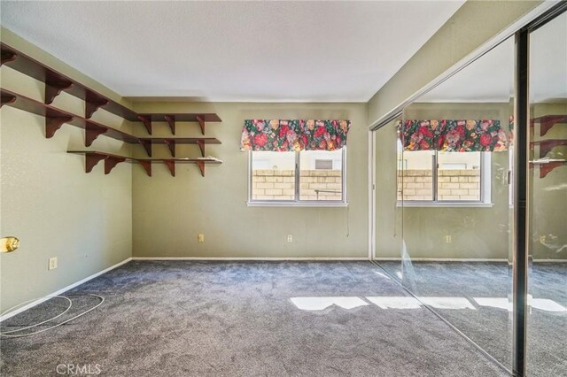 12958 Boston Ave, Chino, CA 91710 - empty room with carpet floors and baseboards