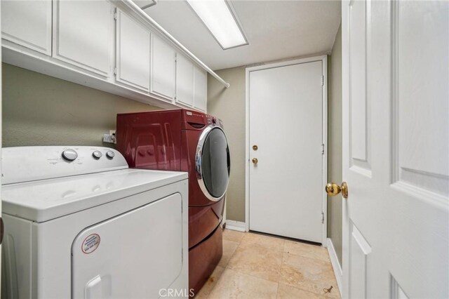 12958 Boston Ave, Chino, CA 91710 - washroom with independent washer and dryer, cabinet space, baseboards, and light tile patterned floors