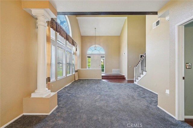 12958 Boston Ave, Chino, CA 91710 - carpeted entryway featuring ornate columns, stairs, baseboards, and high vaulted ceiling