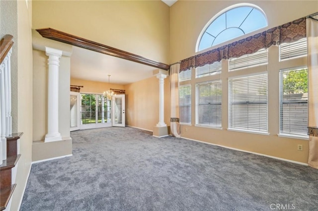12958 Boston Ave, Chino, CA 91710 - empty room with ornate columns, carpet floors, and a towering ceiling