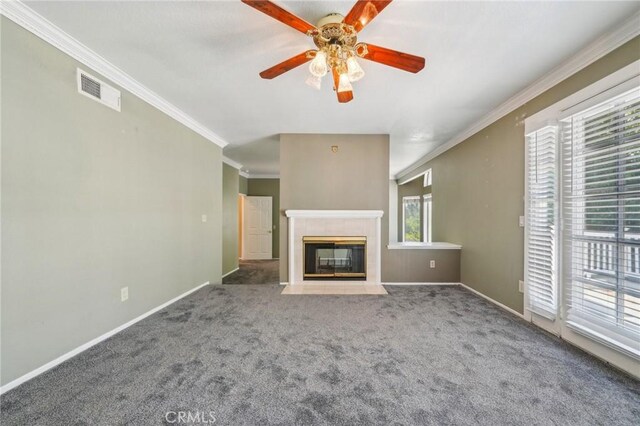 12958 Boston Ave, Chino, CA 91710 - unfurnished living room featuring crown molding, a ceiling fan, carpet, baseboards, and a tiled fireplace