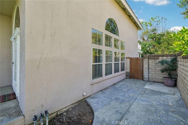 12958 Boston Ave, Chino, CA 91710 - view of side of property featuring a patio area and stucco siding