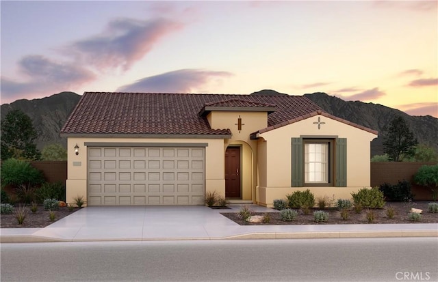 21441 Nicolas Dr, Riverside, CA 92507 - mediterranean / spanish house featuring a mountain view, stucco siding, and concrete driveway