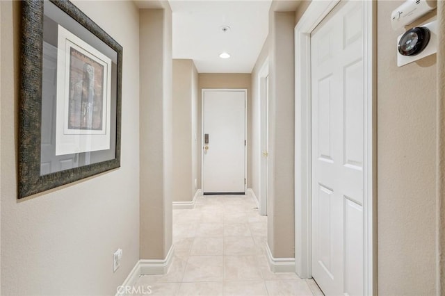 23423 Abbey Glen Pl Unit 30, Valencia, CA 91354 - hallway featuring light tile patterned floors and baseboards