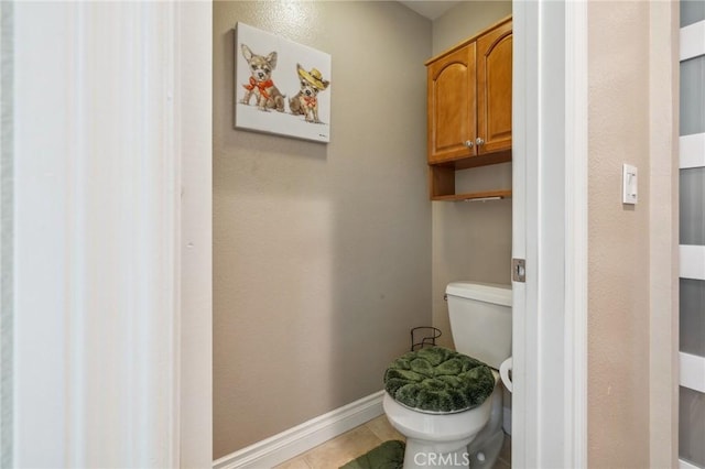 23423 Abbey Glen Pl Unit 30, Valencia, CA 91354 - bathroom with toilet, baseboards, and tile patterned flooring
