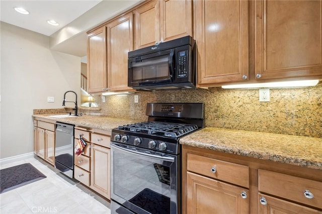 23423 Abbey Glen Pl Unit 30, Valencia, CA 91354 - kitchen with black microwave, stainless steel range with gas cooktop, dishwasher, a sink, and light stone counters