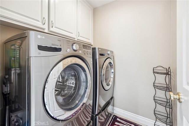 23423 Abbey Glen Pl Unit 30, Valencia, CA 91354 - laundry room featuring washer and dryer, cabinet space, and baseboards