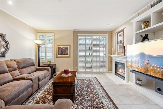 23423 Abbey Glen Pl Unit 30, Valencia, CA 91354 - tiled living room with a glass covered fireplace, baseboards, and ornamental molding