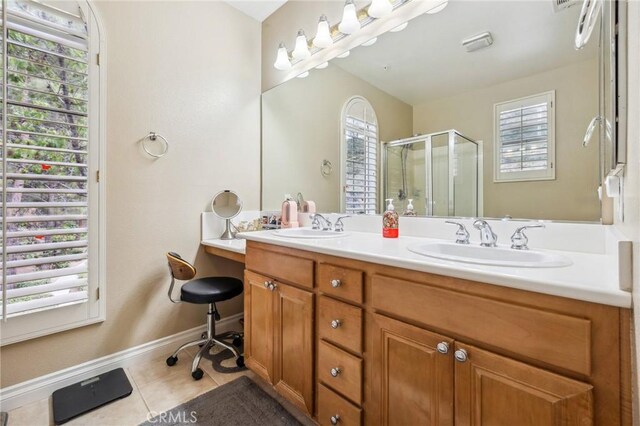 23423 Abbey Glen Pl Unit 30, Valencia, CA 91354 - full bath with tile patterned floors, a stall shower, baseboards, and double vanity