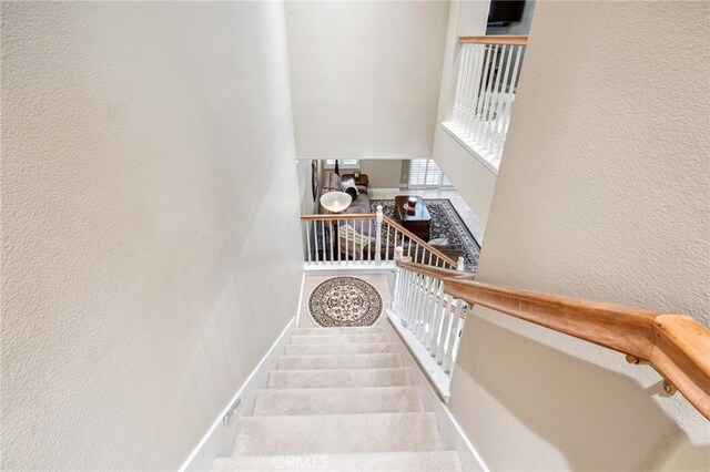 23423 Abbey Glen Pl Unit 30, Valencia, CA 91354 - stairs featuring a textured wall and baseboards