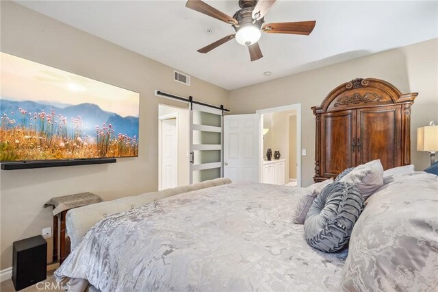 23423 Abbey Glen Pl Unit 30, Valencia, CA 91354 - bedroom featuring a barn door, baseboards, and a ceiling fan