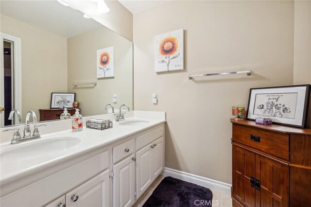 23423 Abbey Glen Pl Unit 30, Valencia, CA 91354 - bathroom featuring baseboards and double vanity