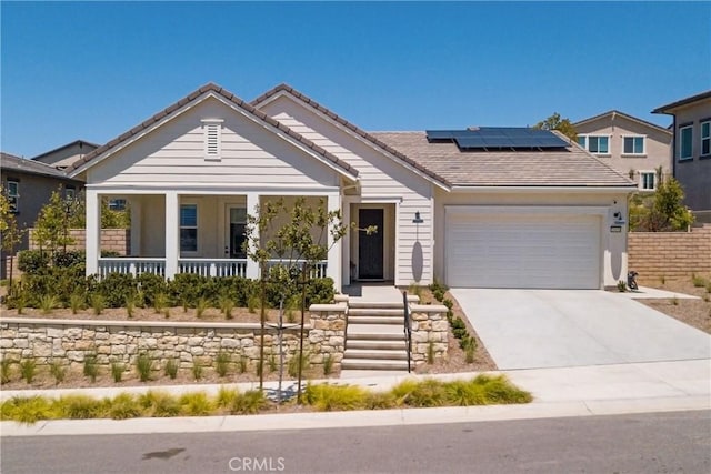 39454 Chamise St, Temecula, CA 92591 - single story home featuring a tile roof, a porch, a garage, roof mounted solar panels, and concrete driveway
