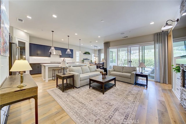 39454 Chamise St, Temecula, CA 92591 - living room featuring light wood finished floors and recessed lighting