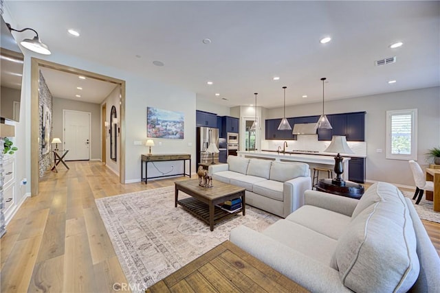 39454 Chamise St, Temecula, CA 92591 - living area featuring baseboards, light wood finished floors, and recessed lighting