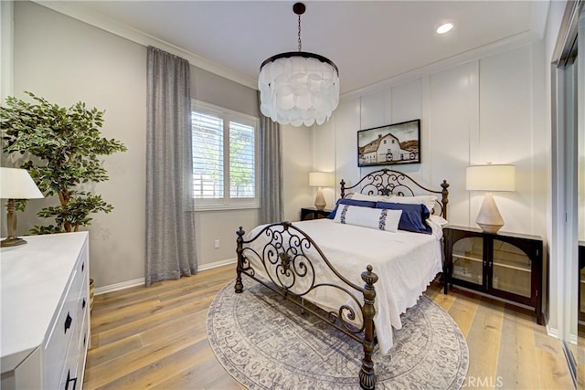 39454 Chamise St, Temecula, CA 92591 - bedroom featuring a chandelier, light wood-type flooring, recessed lighting, crown molding, and baseboards