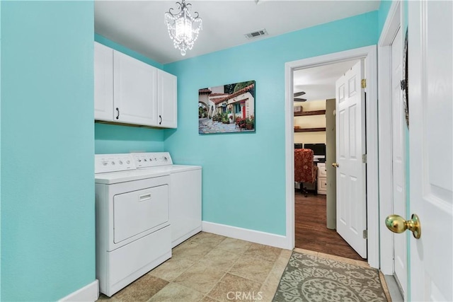 57490 Redondo St, Yucca Valley, CA 92284 - laundry area featuring separate washer and dryer, cabinet space, baseboards, and a chandelier