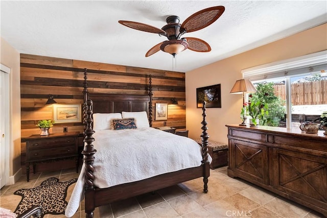 57490 Redondo St, Yucca Valley, CA 92284 - bedroom with wooden walls and a ceiling fan