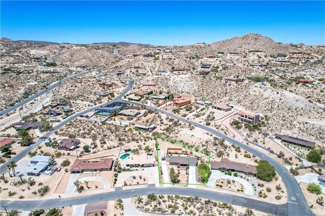 57490 Redondo St, Yucca Valley, CA 92284 - aerial view of property's location featuring a desert landscape and a mountainous background