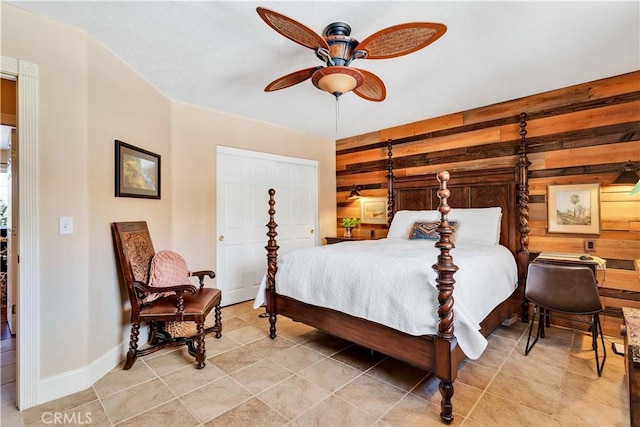 57490 Redondo St, Yucca Valley, CA 92284 - bedroom featuring wooden walls, baseboards, and ceiling fan