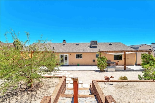 57490 Redondo St, Yucca Valley, CA 92284 - back of property featuring a patio, a chimney, stucco siding, and a pergola