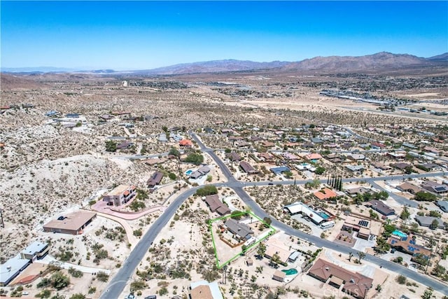 57490 Redondo St, Yucca Valley, CA 92284 - aerial view of property and surrounding area featuring a mountain backdrop and a desert landscape