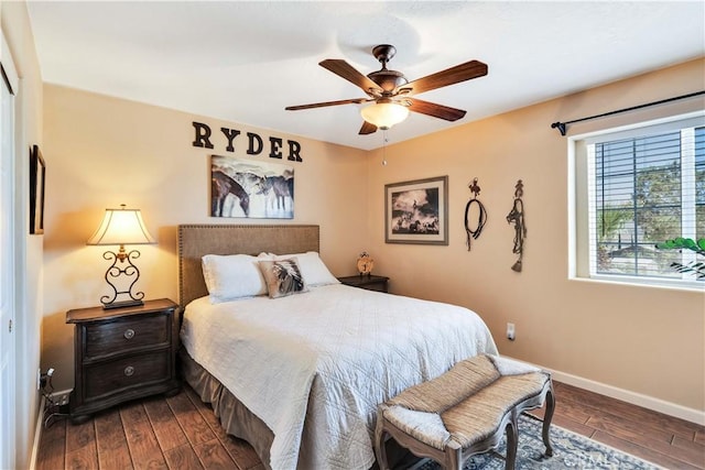57490 Redondo St, Yucca Valley, CA 92284 - bedroom with dark wood-style flooring, baseboards, and ceiling fan