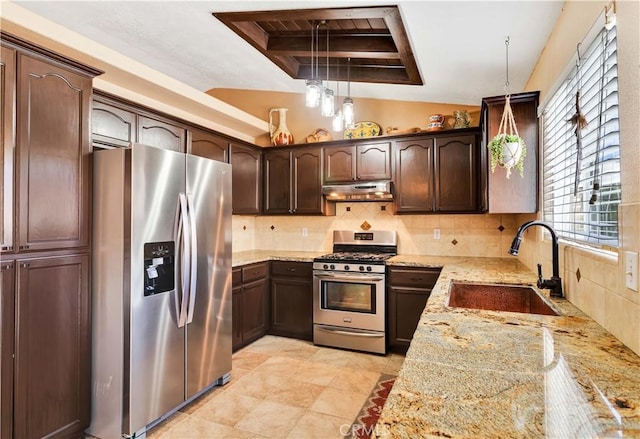 57490 Redondo St, Yucca Valley, CA 92284 - kitchen with appliances with stainless steel finishes, under cabinet range hood, a sink, a raised ceiling, and dark brown cabinetry