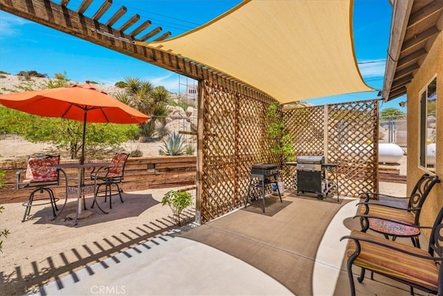 57490 Redondo St, Yucca Valley, CA 92284 - view of patio / terrace featuring grilling area, a pergola, and outdoor dining area