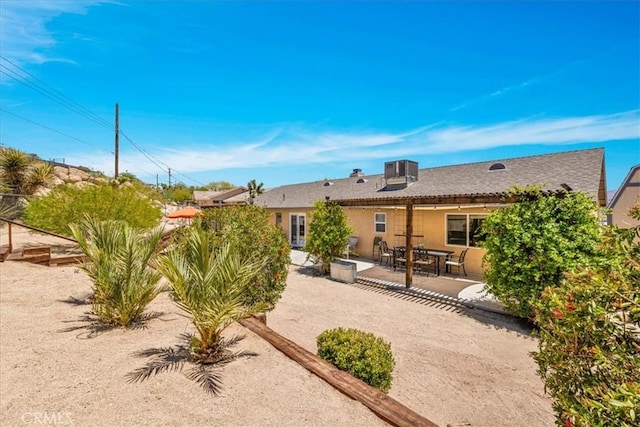 57490 Redondo St, Yucca Valley, CA 92284 - back of house with a patio area, stucco siding, and cooling unit