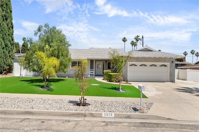 5979 Stanton Ave, Highland, CA 92346 - ranch-style home featuring driveway, an attached garage, and stucco siding