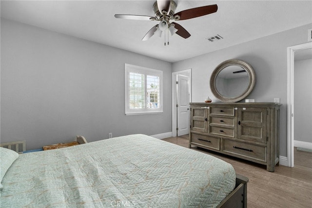 5979 Stanton Ave, Highland, CA 92346 - bedroom with baseboards, wood finished floors, and a ceiling fan