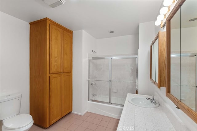14259 Emelita St, Van Nuys, CA 91401 - bathroom featuring tile patterned flooring, toilet, combined bath / shower with glass door, and vanity