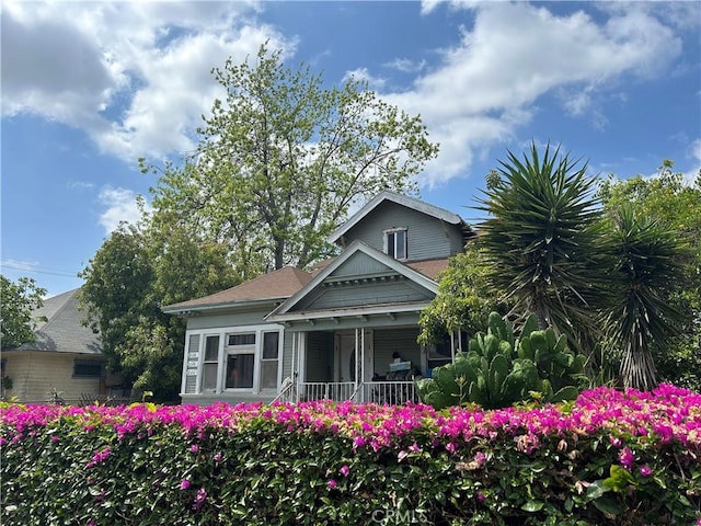 1026 E 23rd St, Los Angeles, CA 90011 - rear view of property featuring a porch