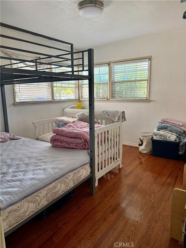 2277 Cogswell Rd, El Monte, CA 91732 - bedroom featuring multiple windows and wood finished floors
