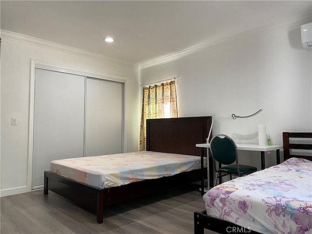 2277 Cogswell Rd, El Monte, CA 91732 - bedroom with ornamental molding, wood finished floors, a closet, recessed lighting, and a wall mounted air conditioner
