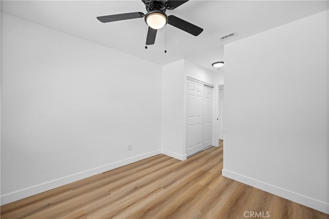 1608 Heron Ct, Redlands, CA 92374 - unfurnished room with baseboards, light wood-style floors, and a ceiling fan