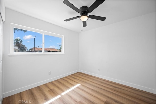 1608 Heron Ct, Redlands, CA 92374 - spare room featuring wood finished floors, baseboards, and a ceiling fan