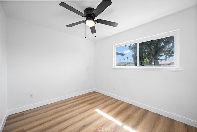 1608 Heron Ct, Redlands, CA 92374 - spare room with light wood-style floors, baseboards, and a ceiling fan