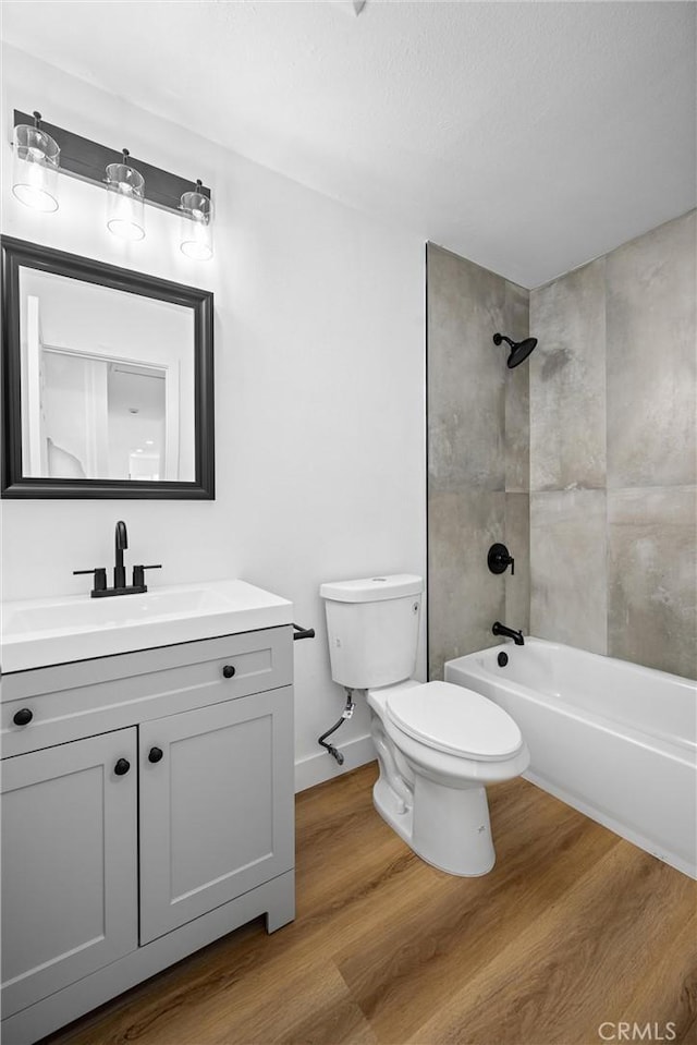 1608 Heron Ct, Redlands, CA 92374 - full bath featuring toilet, vanity, wood finished floors, and  shower combination