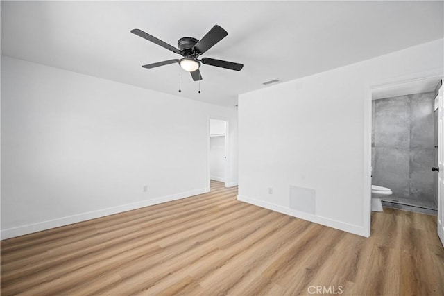 1608 Heron Ct, Redlands, CA 92374 - unfurnished bedroom featuring light wood-style floors, baseboards, ensuite bath, ceiling fan, and a closet
