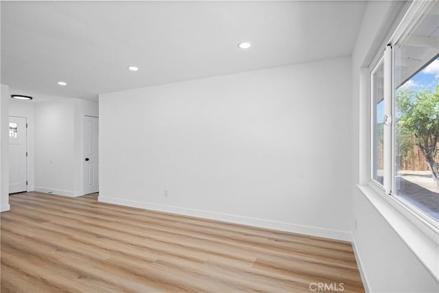 1608 Heron Ct, Redlands, CA 92374 - empty room featuring light wood-type flooring, recessed lighting, and baseboards