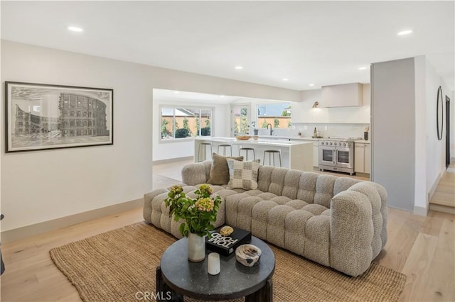 2012 Nantucket Pl, Tustin, CA 92780 - living area featuring recessed lighting, light wood-style floors, and baseboards