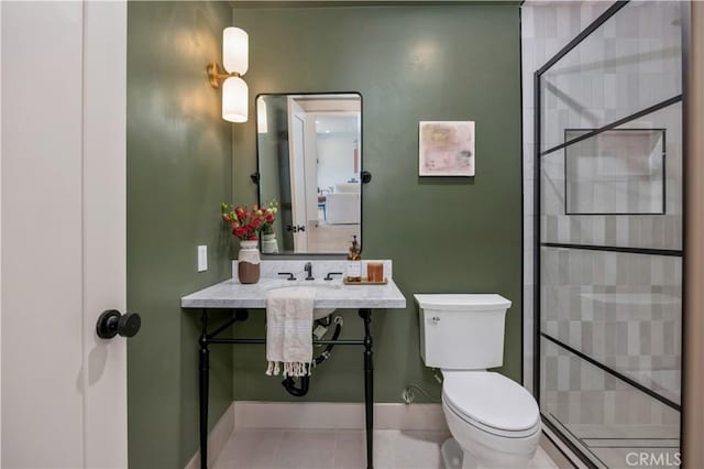 2012 Nantucket Pl, Tustin, CA 92780 - bathroom featuring toilet, a stall shower, tile patterned floors, and baseboards