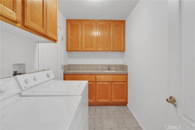 14303 Schooner Dr, Helendale, CA 92342 - laundry room featuring cabinet space, separate washer and dryer, and baseboards